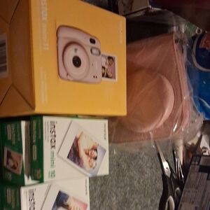 Fujifilm Instax Mini Camera and Accessories in Yellow and Pink